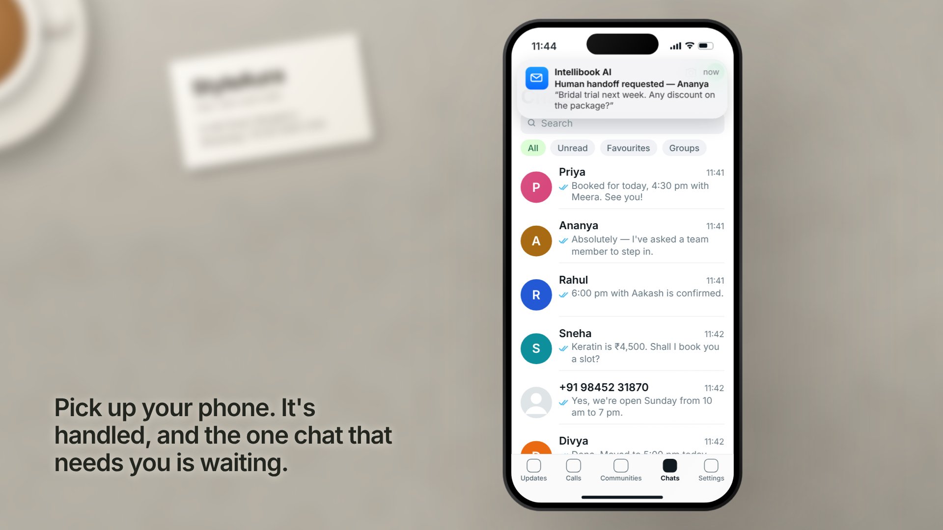 A salon owner's phone on the counter: IntelliBook answers each WhatsApp message with bookings, prices and changes, and hands one chat to the owner (sample conversations)